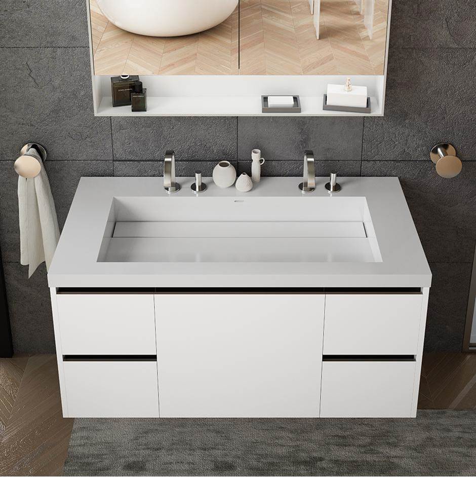 Lacava Vanity-top wide center-bowl Bathroom Sink made of solid surface, with an overflow and decorative drain cover.